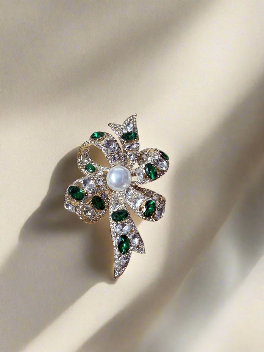 Kenneth Jay Lane Crystal and Emerald Bow Shaped Pin - Mildred Hoit