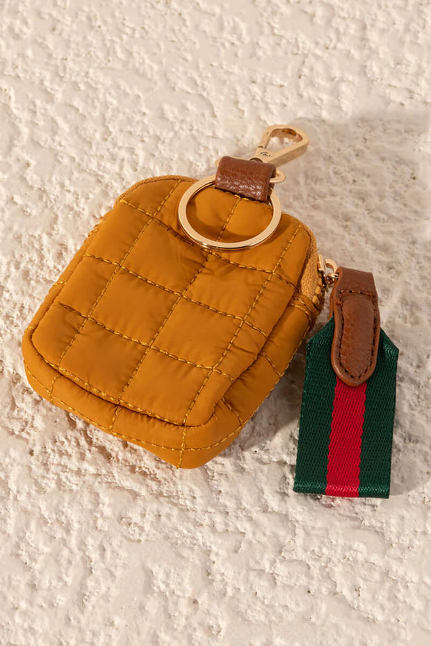 Shiraleah Quilted Clip On Pouch in Honey available at Mildred Hoit in Palm Beach. 