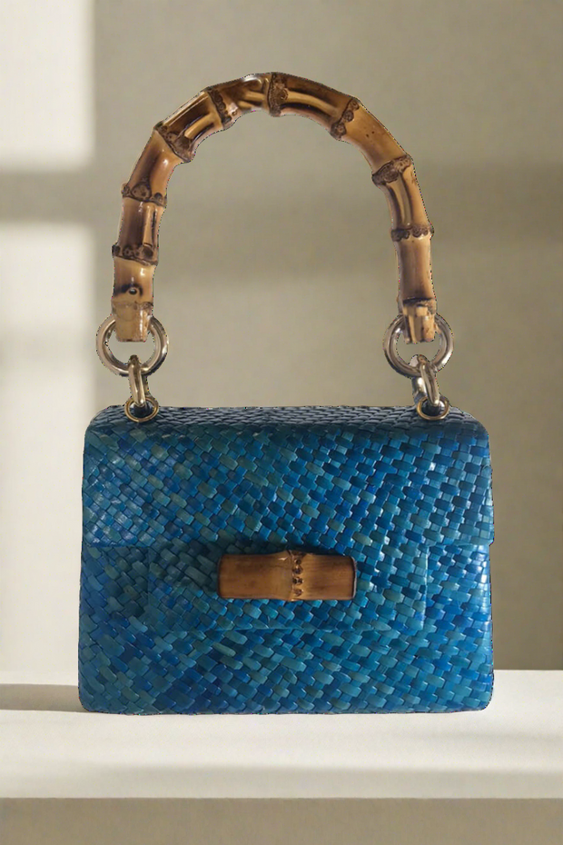 Stella Straw Handbag in Blue available at Mildred Hoit in Palm Beach.
