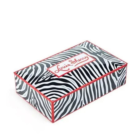 Louis Sherry 12 piece Zebra Tin available at Mildred Hoit in Palm Beach.