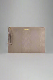 Leather Uber Clutch in Stone available at Mildred Hoit in Palm Beach.