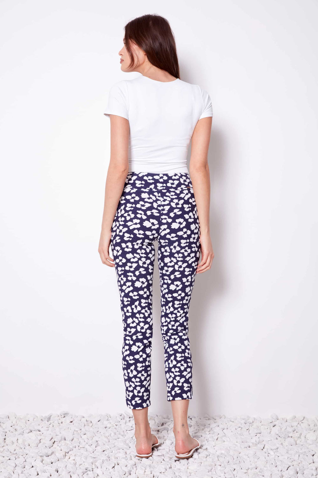 Model Wearing Up! Florist Petal - Slit Techno Ankle Pant available at Mildred Hoit in Palm Beach.