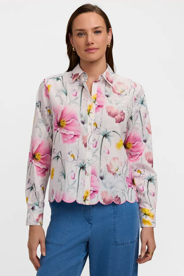 Woman wearing a floral blouse with a plain background