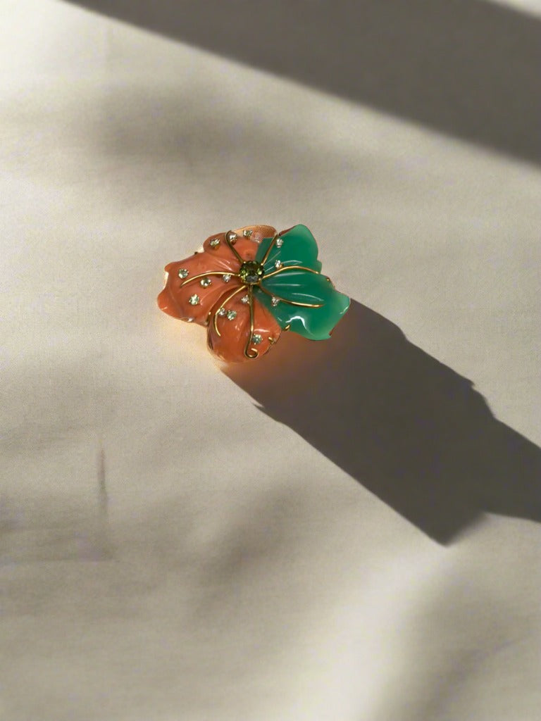 Chrysoprase, Coral, Tourmaline, Sapphire, and Diamond Brooch available at Mildred Hoit in Palm Beach.