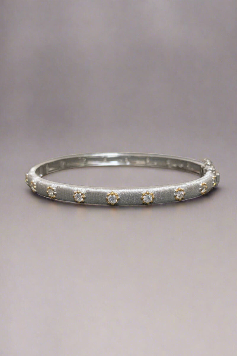 Narrow Rhodium, Crystal, and Gold Bracelet available at Mildred Hoit in Palm Beach.