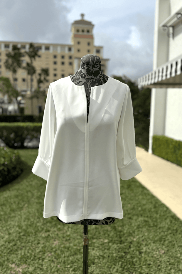 Emmelle 3/4 Sleeve Luxurious Crepe V-Neck Tunic in Pearl available at Mildred Hoit in Palm Beach.