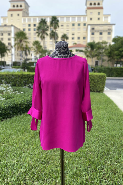 Emmelle Silk Blouse with Satin Tie Cuff in Fuchsia available at Mildred Hoit in Palm Beach.