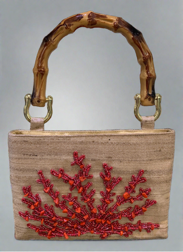 Tiana Coral Bag with Bamboo Handle available at Mildred Hoit in Palm Beach.
