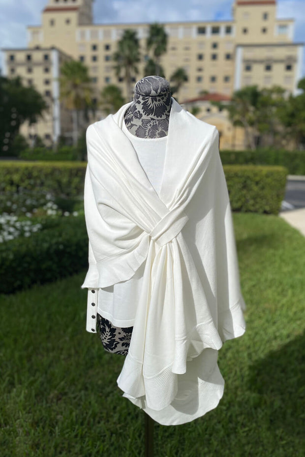Knit Shawl with Ruffle Detail in Ivory available at Mildred Hoit in Palm Beach.