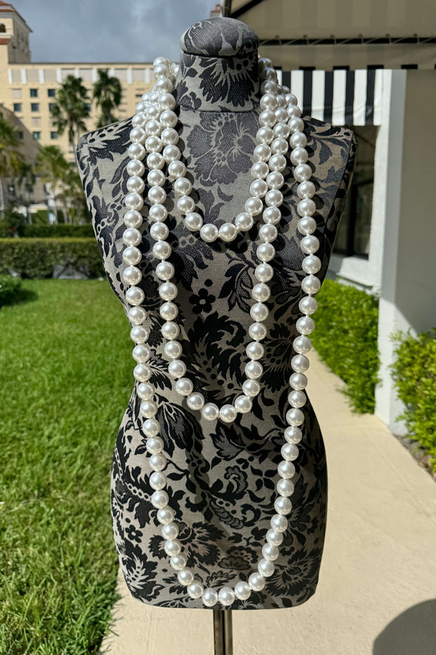 Kenneth Jay Lane Long White Pearl Necklace available at Mildred Hoit in Palm Beach.