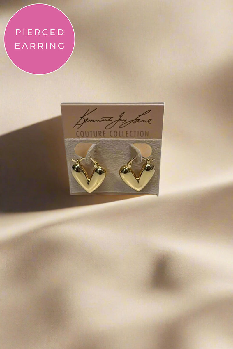 Gold heart-shaped earrings displayed on a branded jewelry card. A pink circular badge in the top left reads 'PIERCED EARRING.