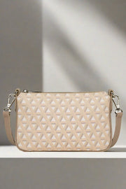 Ikon Beige Small Clutch Bag available at Mildred Hoit in Palm Beach.