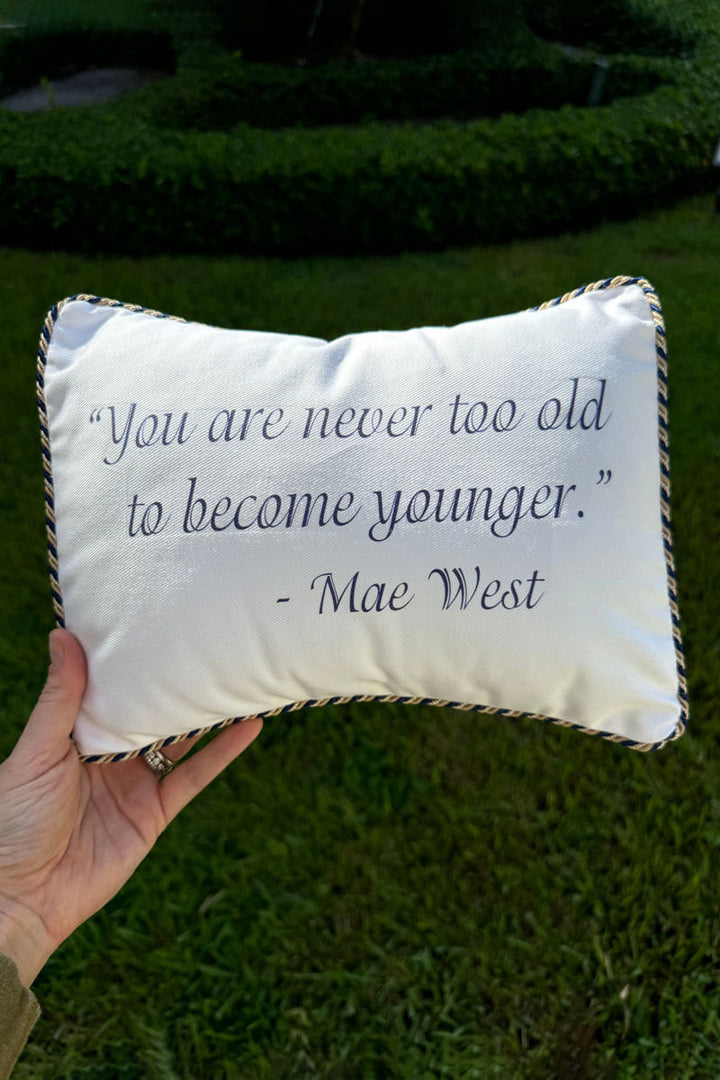 Decorative Pillow that says "You are never too old to become younger. - Mae West"