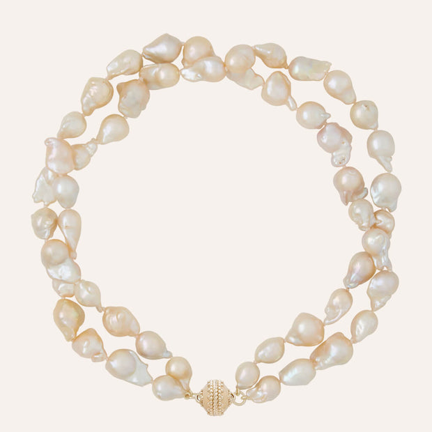 Clara Williams Small Peach Baroque Pearl Double Strand Necklace available at Mildred Hoit in Palm Beach.