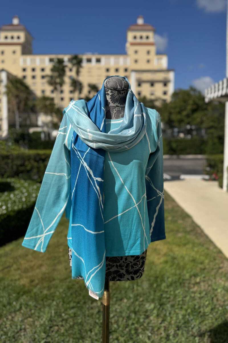 Pashma Blues with Cracked Lines Sweater and Scarf Set available at Mildred Hoit in Palm Beach.