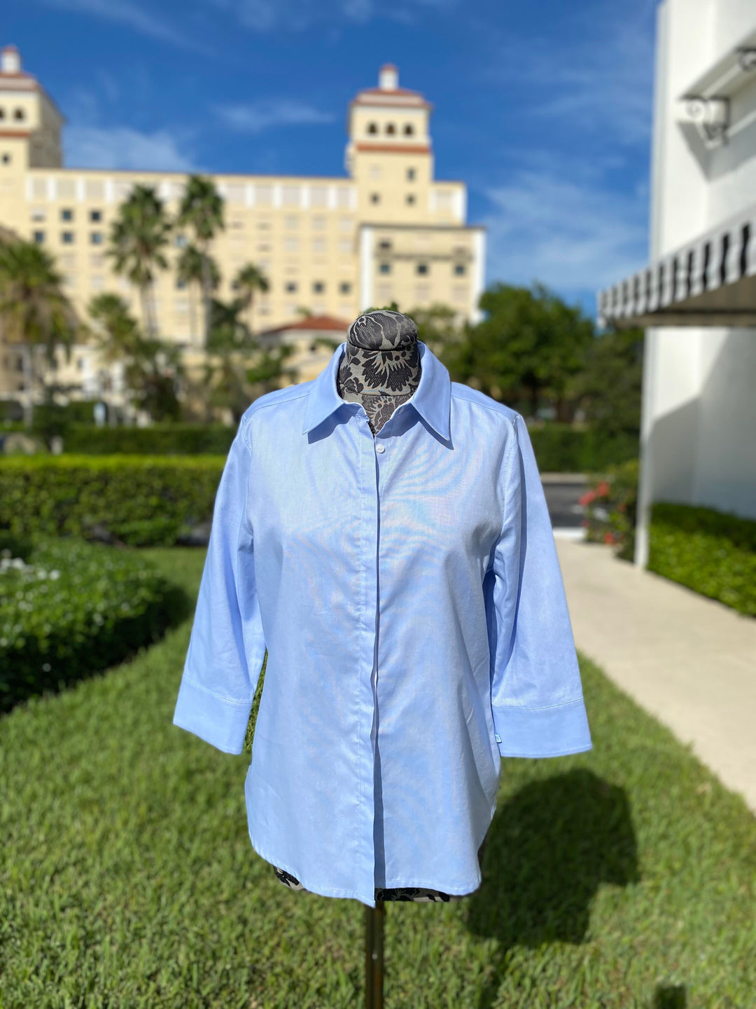 Blue and White Solid Button Down Blouse available at Mildred Hoit in Palm Beach.