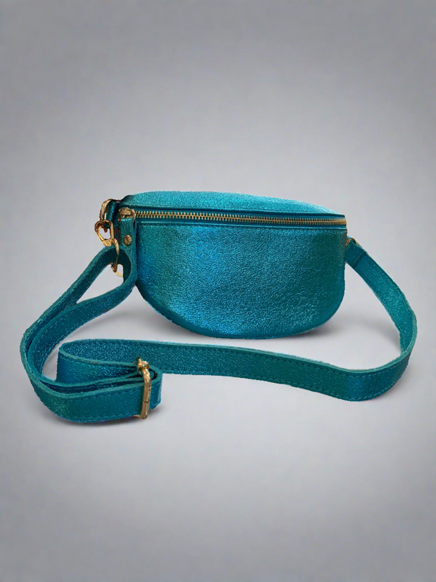 Metallic Turquoise Fanny Pack available at Mildred Hoit in Palm Beach.