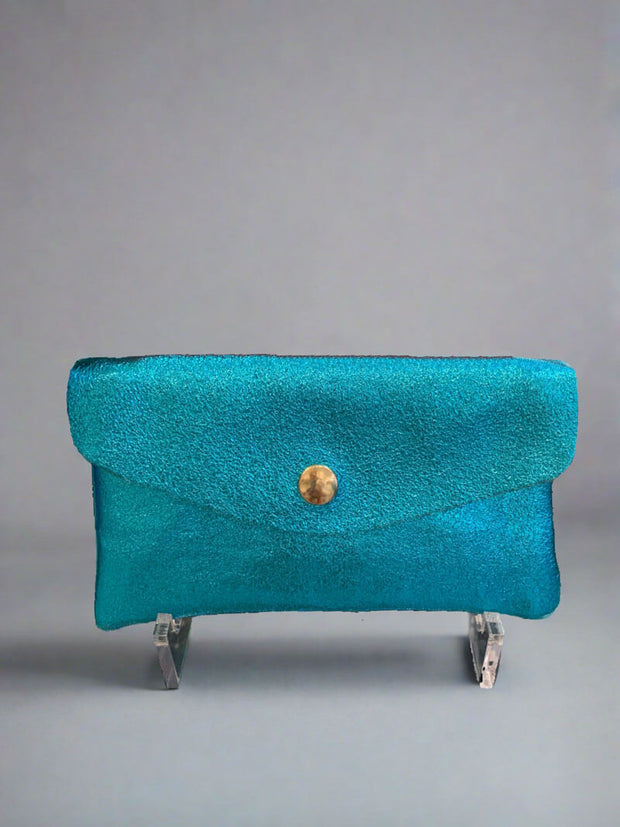 Metallic Turquoise Coin Wallet available at Mildred Hoit in Palm Beach.