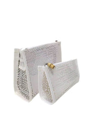 Two's Company White Lattice Design Cosmetic Bags available at Mildred Hoit in Palm Beach.