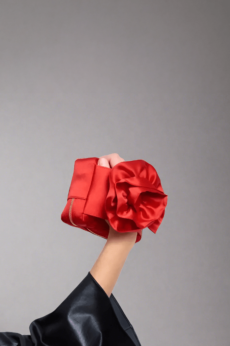 Satin Red Rose Shaped Clutch Bag available at Mildred Hoit in Palm Beach.