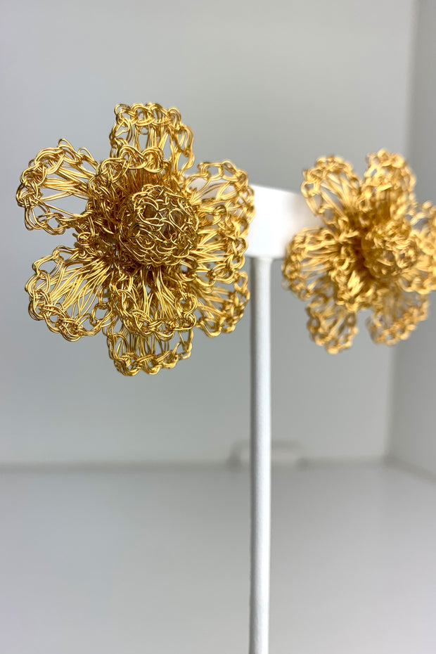 Detailed View of Lavish Gold Flower Earrings with Crocheted Center available at Mildred Hoit in Palm Beach.