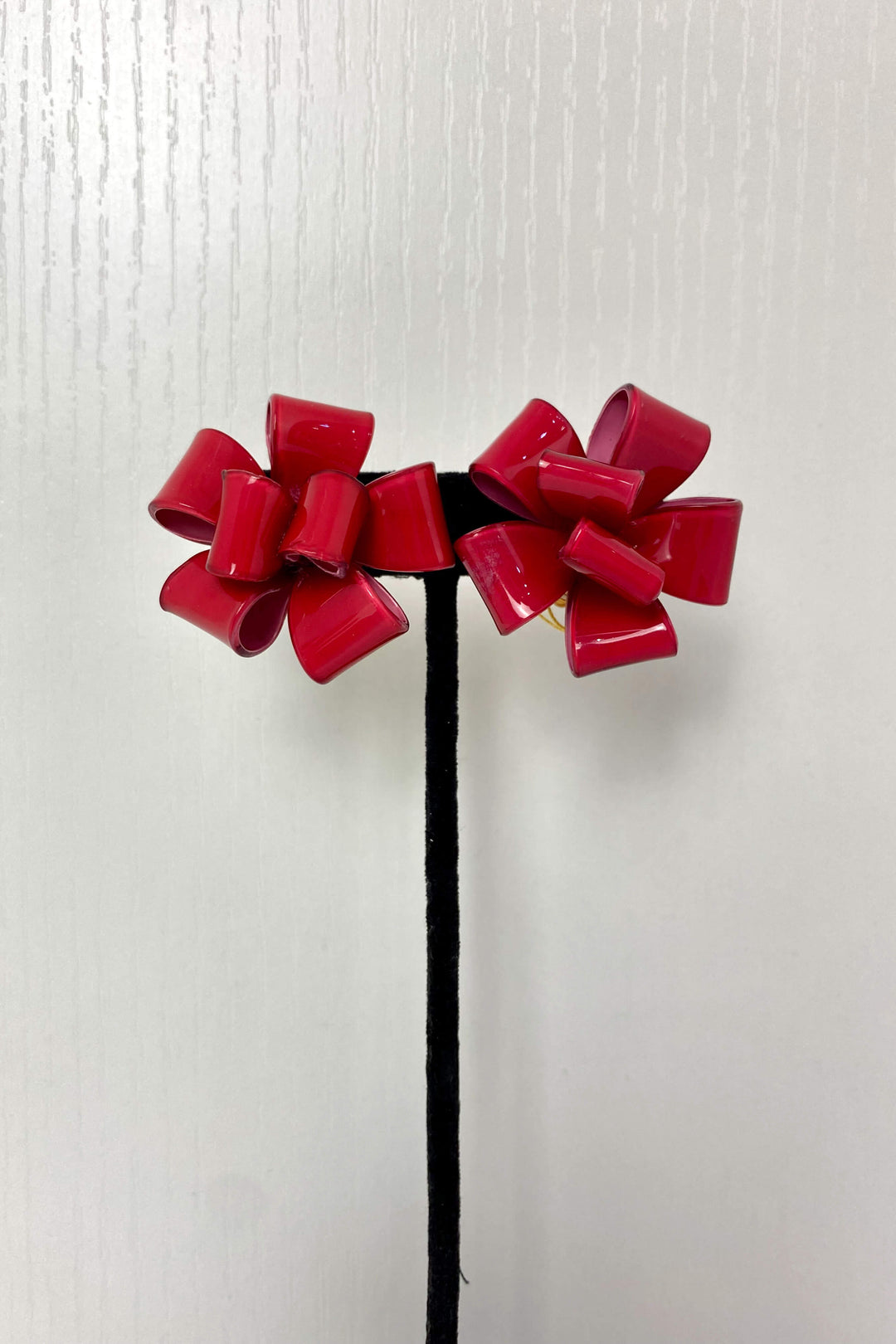 French Ambre Bow Earrings in Pink available at Mildred Hoit.