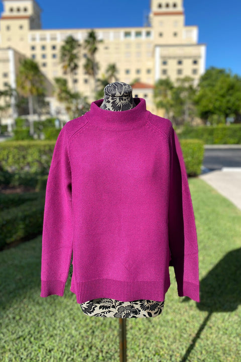 Kinross Garter Funnel Sweater in Black Cherry available at Mildred Hoit in Palm Beach.