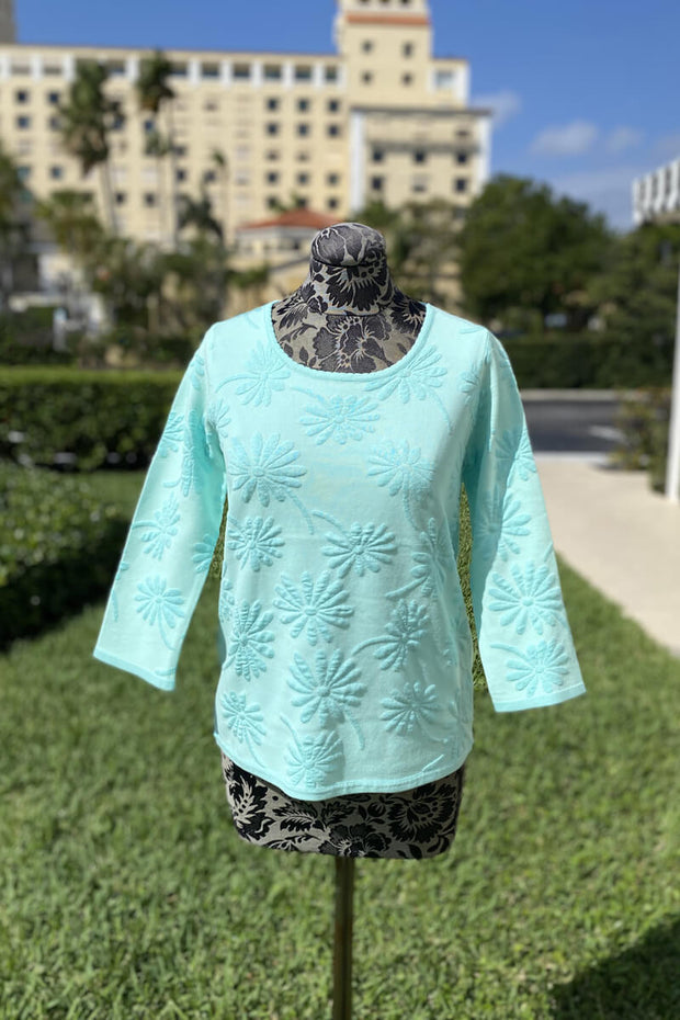 Leo & Ugo Floral Crew Neck Sweater in Turquoise available at Mildred Hoit in Palm Beach.