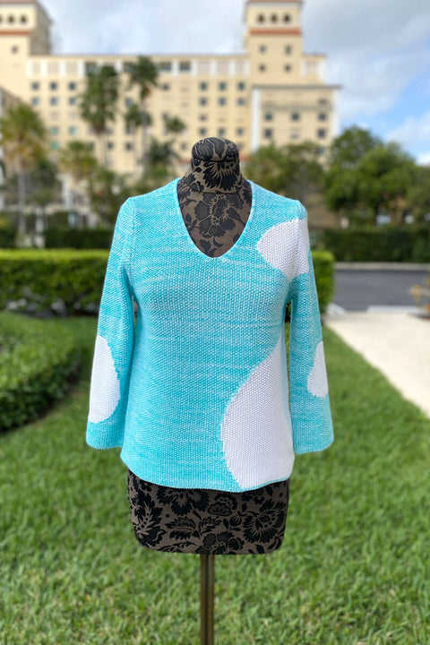 Teal Sweater with White Geometric Dots available at Mildred Hoit.
