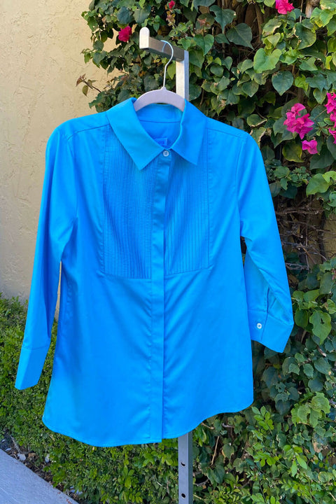 Blue Button Down Cotton Blouse available at Mildred Hoit.
