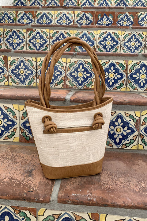 Small Tan Leather and Canvas Handbag available at Mildred Hoit in Palm Beach.