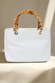 White Italian Deerskin Handbag With Bamboo Handles available at Mildred Hoit in Palm Beach.