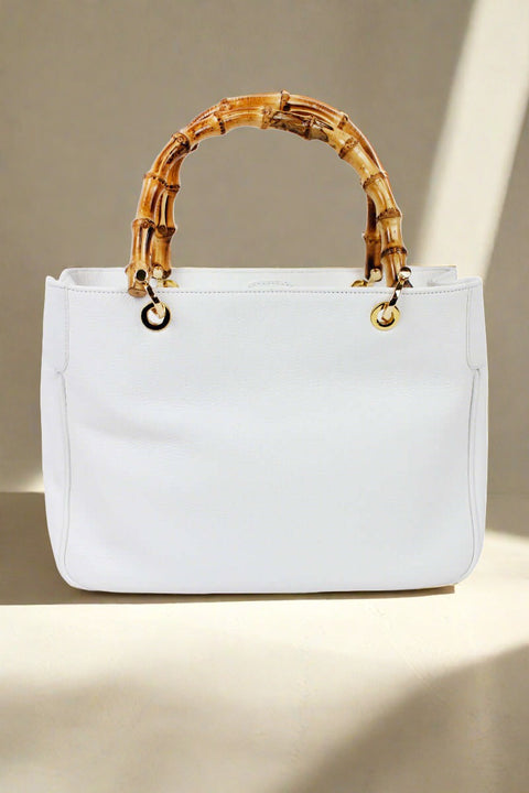 White Italian Deerskin Handbag With Bamboo Handles available at Mildred Hoit in Palm Beach.
