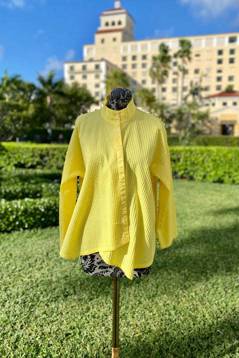 Yacco Maricard Asymmetrical Cotton Blouse in in Lemon Curd available at Mildred Hoit in Palm Beach.