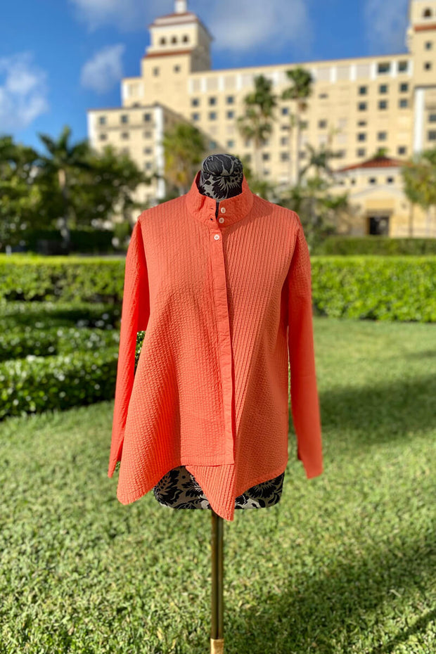 Yacco Maricard Asymmetrical Cotton Blouse in Orange available at Mildred Hoit in Palm Beach.