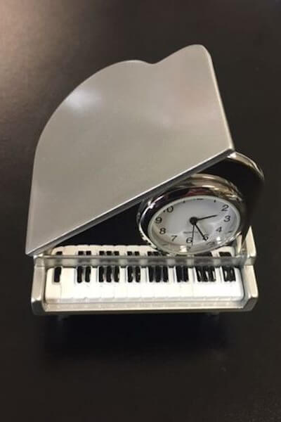 Grand Piano Clock available at Mildred Hoit in Palm Beach.